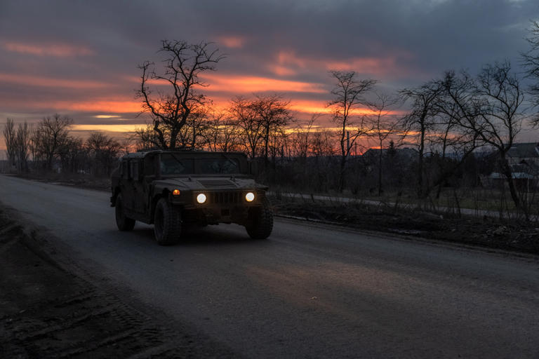 A Ukrainian serviceman drives a U.S.-made Humvee on a road leading to the town of Chasiv Yar, in the Donetsk region, on March 30, 2024. Ukrainian forces are on the back foot, hoping for more military aid from Western partners. ROMAN PILIPEY/AFP via Getty Images